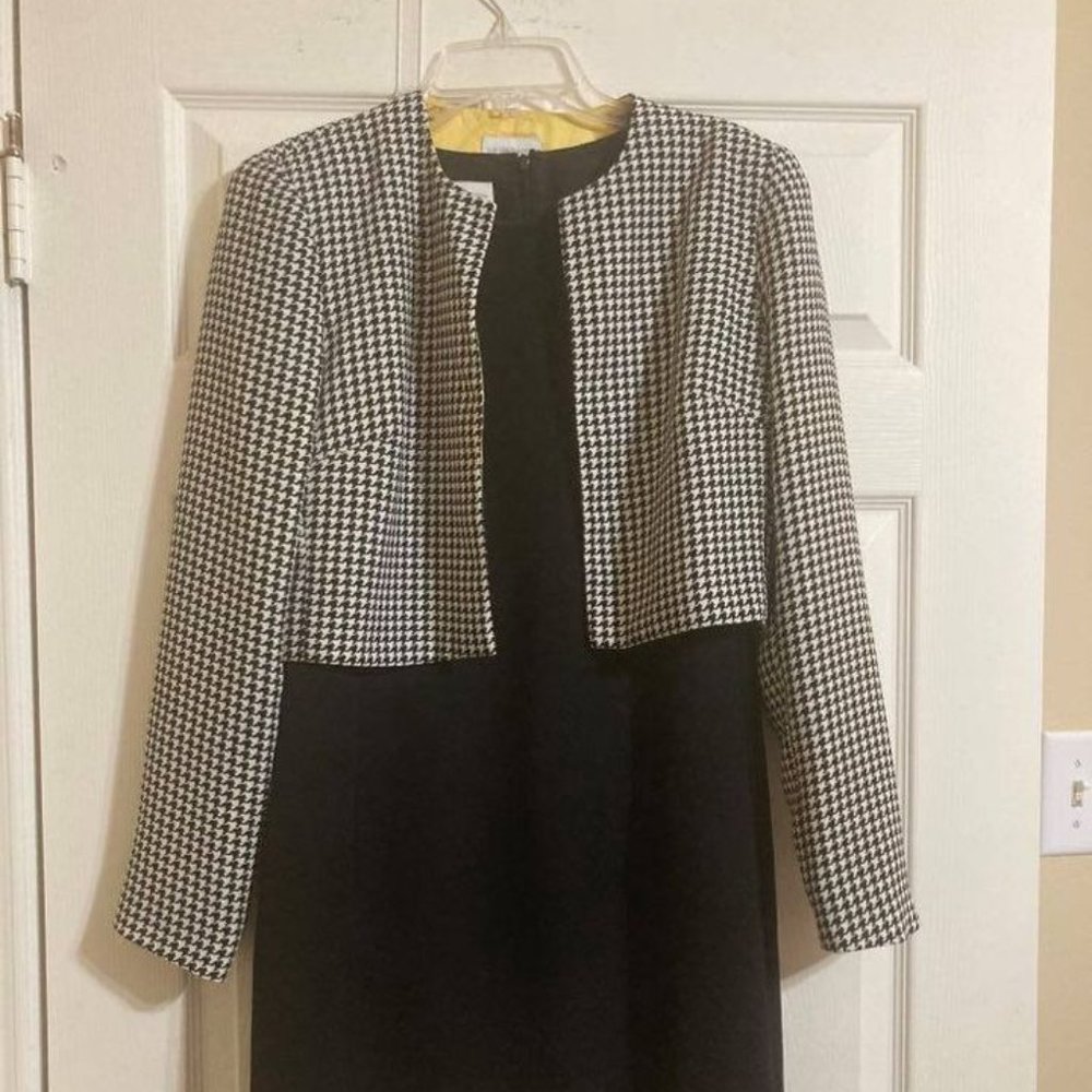 Sophisticated Fitted black shell sleeveless dress with hounds tooth jacket